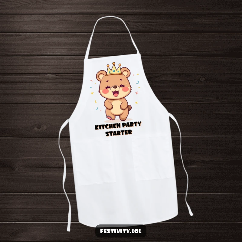 Funny apron with a giggling bear cub wearing a streamer crown and dancing, ideal for kitchen parties and cooking.