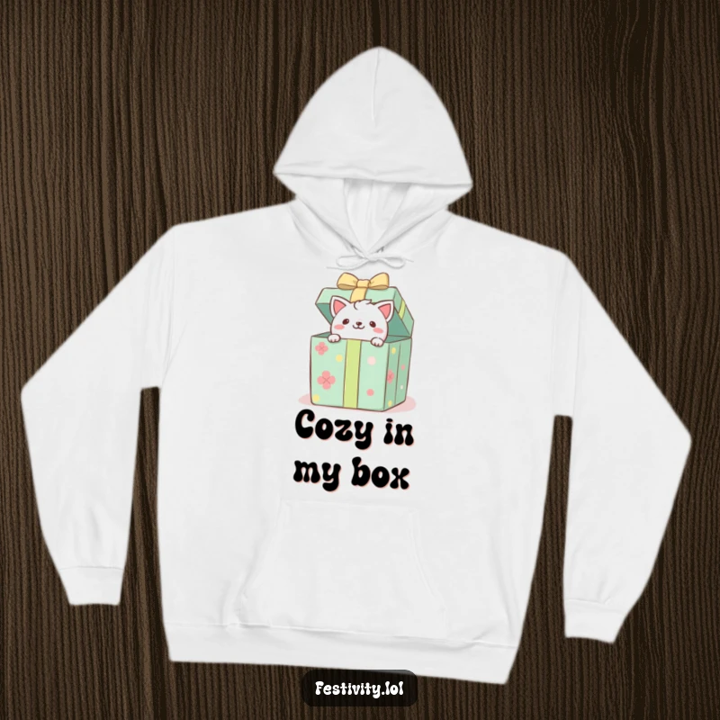 Funny hoodie with a playful critter emerging from a decorated gift box, offering warmth and a humorous surprise.