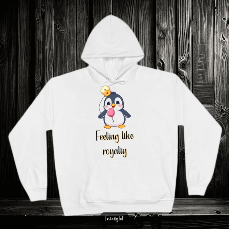 Funny hoodie featuring a surprised penguin wearing a tiny crown and holding a balloon, perfect for cozy royalty.