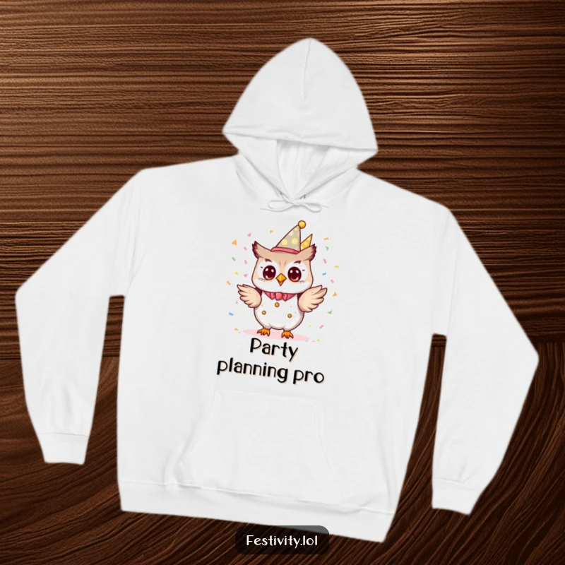 Funny tiny owl character dressed as a party planner, excitedly tossing confetti on a cozy hoodie.