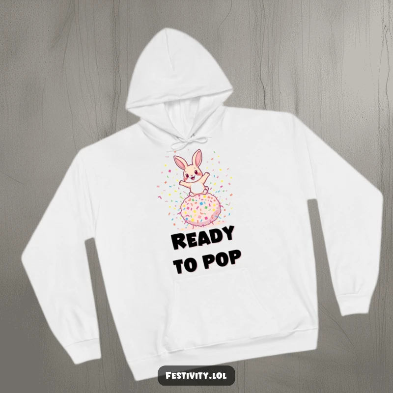 Funny rabbit hoodie featuring a playful rabbit bouncing on a giant confetti bomb, offering warmth and a dose of explosive humor.
